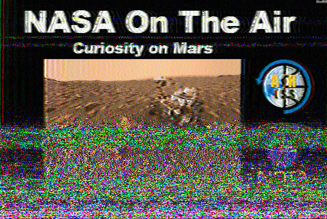 Image with a picture of Curiosity on Mars, captioned NASA On the Air - Curiosity on Mars ARISS