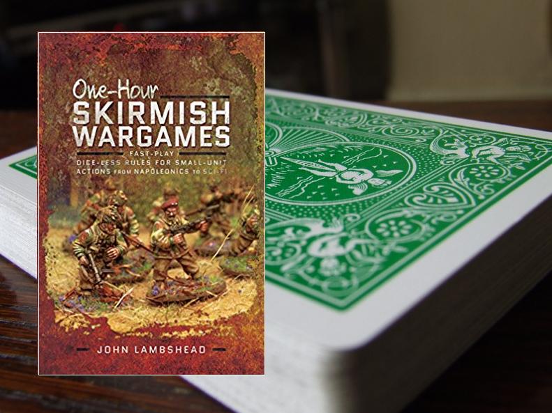 Photo of One Hour Skirmish Wargames book with playing cards in background